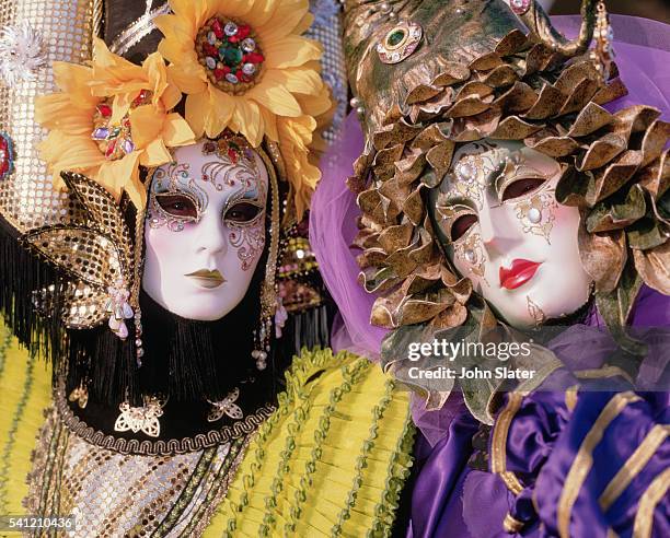 costumed people at carnival - venetian mask stock pictures, royalty-free photos & images