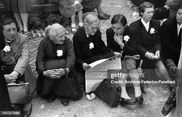 Italians waits to listen to a speech at the Castello Sforezesco.