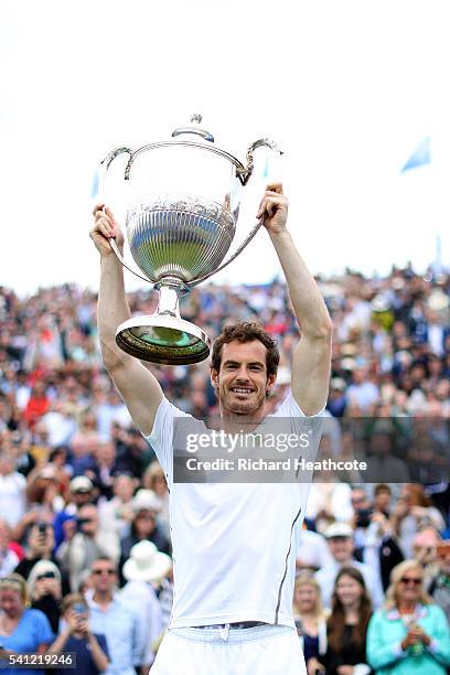 Andy Murray of Great Britain lifts the trophy after victory in the final of The Aegon Championships aganist Milos Raonic of Canada on day seven at...