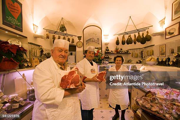 the martini family in their traditional butcher shop, macelleria martini - sansepolcro stock pictures, royalty-free photos & images