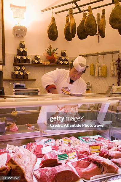 butcher at macelleria martini cutting bistecca fiorentina - sansepolcro stock pictures, royalty-free photos & images