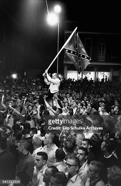 Hundreds of University of Mississippi students rally at night against integration of the university. The rally later disintegrated into a riot.