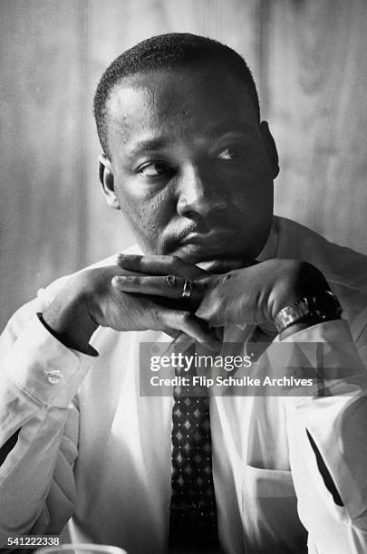 Martin Luther King Jr. Listens to other staff members of SCLC during a meeting at an Atlanta restaurant.