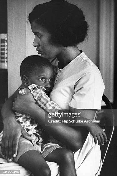 Myrlie Evers holds her young son James Van Dyke the morning after her husband civil rights leader Medgar Evers was killed.