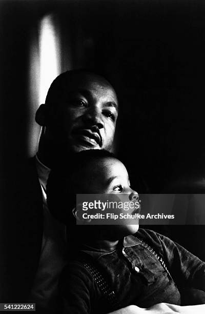 Martin Luther King Jr. Holds his young son Dexter on his lap at home in Atlanta. That day, King was informed that he would receive the 1964 Nobel...