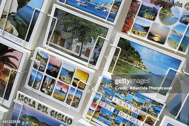 postcards in giglio porto souvenir shop - giglio stock-fotos und bilder
