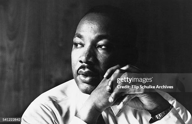 Martin Luther King Jr. Listens to other staff members of SCLC during a meeting at an Atlanta restaurant.