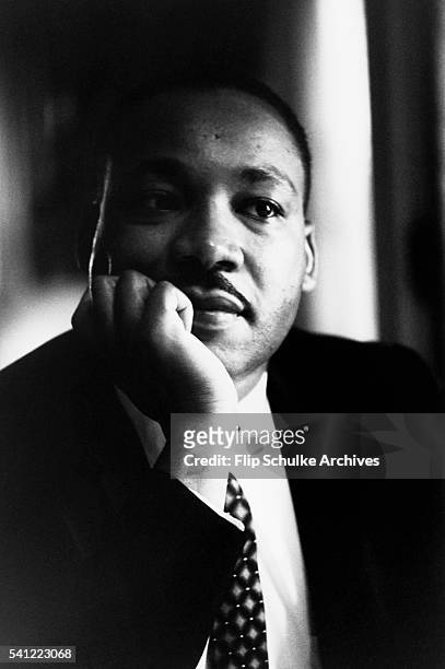 Martin Luther King Jr. Listens to other staff members of SCLC during a meeting at an Atlanta restaurant.