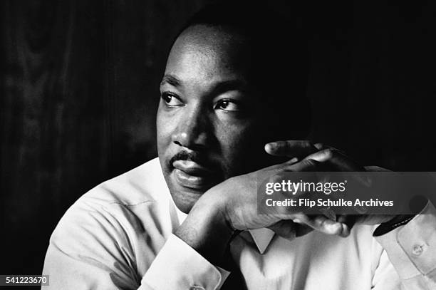 Martin Luther King Jr. Listens at a meeting of the SCLC, the Southern Christian Leadership Conference, at a restaurant in Atlanta. The SCLC is a...