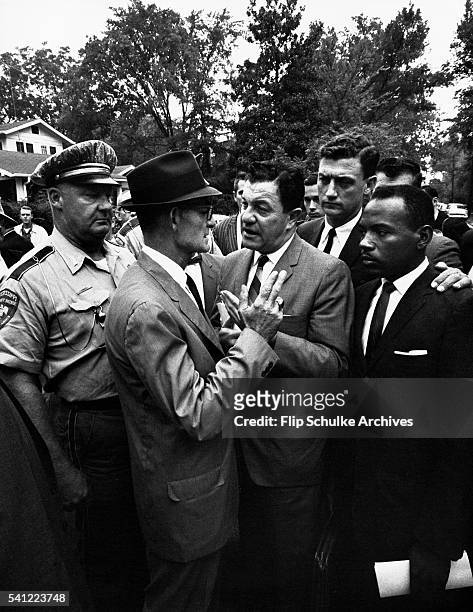 Mississippi Lieutenant Governor Paul Johnson blocks James Meredith, U.S. Marshal J.P. McShane, and Justice Department attorney John Doar from...