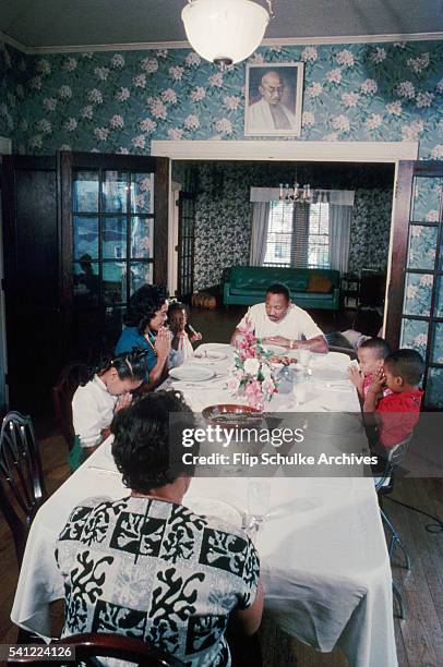 Martin Luther King Jr. And his family pray before eating their Sunday dinner after church.