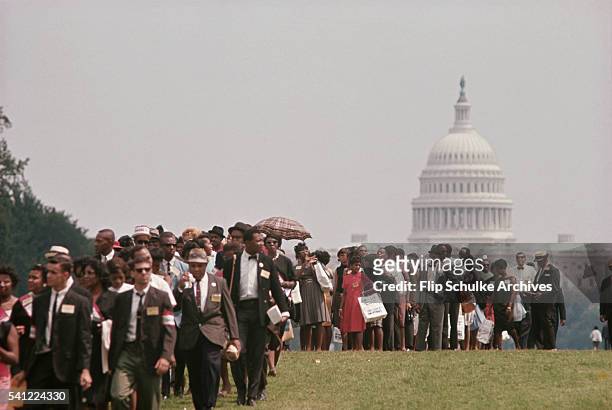 Civil Rights marchers pass the US Capitol on the Mall during the March on Washington, Washington DC, August 28, 1963.
