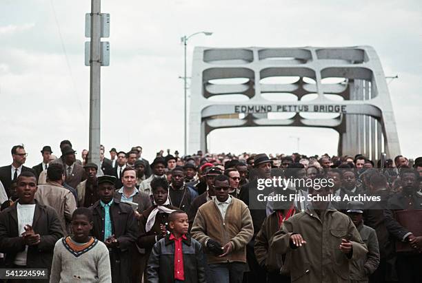 Civil rights marchers cross Edmund Pettus Bridge in the second attempt to march to Montgomery, 9th March 1965. The march was turned around by the...
