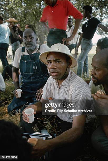 James Meredith rests under shady trees with other marchers along a highway during the March Against Fear through rural Mississippi. Meredith, the...