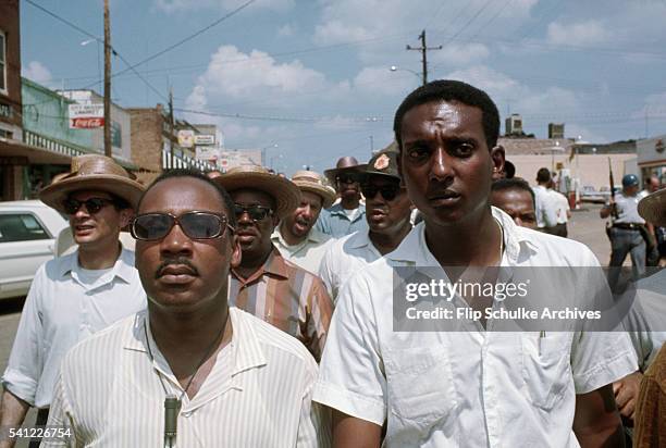 Martin Luther King Jr. And Stokely Carmichael walk together as the March Against Fear walks through the town of Philadelphia. The march went to...