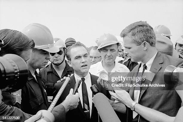 Journalists interview Alabama Governor George Wallace during his attempts to block integration of the state schools.