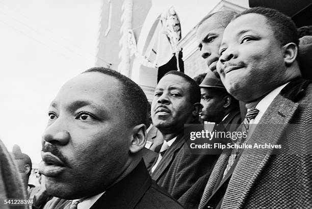 Civil rights leaders, including Martin Luther King Jr., Ralph Abernathy, and Hosea Williams, stand on the steps of Brown Chapel in Selma.