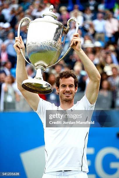 Andy Murray of Great Britain lifts the trophy victory in his final match against Milos Raonic of Canada during day seven of the Aegon Championships...