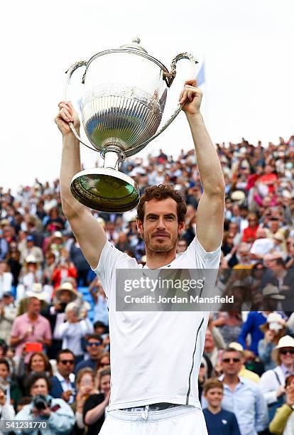 Andy Murray of Great Britain lifts the trophy victory in his final match against Milos Raonic of Canada during day seven of the Aegon Championships...