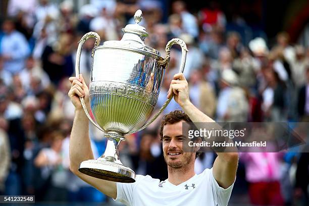 Andy Murray of Great Britain lifts the trophy victory in his final match against Milos Raonic of Canada during day seven of the Aegon Championships...