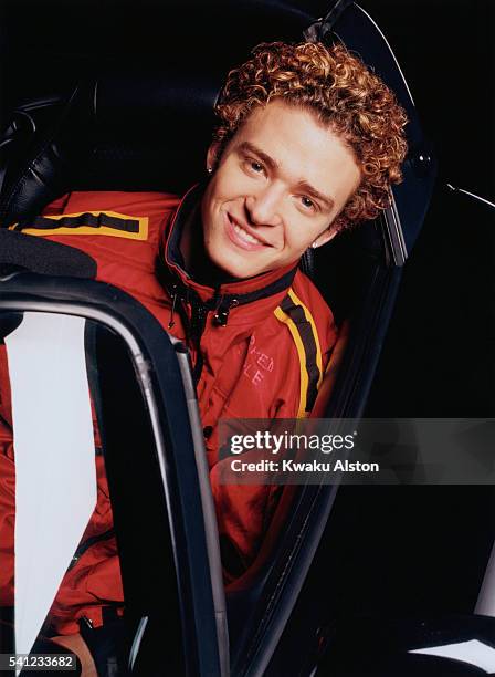 Singer Justin Timberlake of 'N Sync is photographed in a sports car for YM Magazine in 2000 in Los Angeles, California