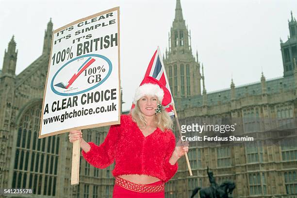 Supporter, Birgit Cunningham, demonstrating outside the Houses of Parliament for clear labelling of origin on produce sold within the United Kingdom.