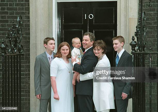 Prime Minister Tony Blair poses with his wife Cherie and their children Nicky, Katherine, Euan and baby Leo.