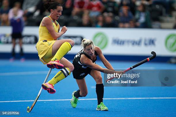 Madonna Blyth of Australia jumps out of the way as Gemma Flynn of New Zealand fires a shot on goal during the FIH Women's Hockey Champions Trophy...