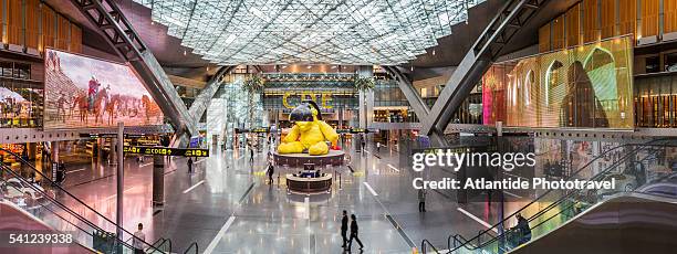 doha international airport, the interior and the sculpture lamp bear by urs fischer - doha airport stock pictures, royalty-free photos & images