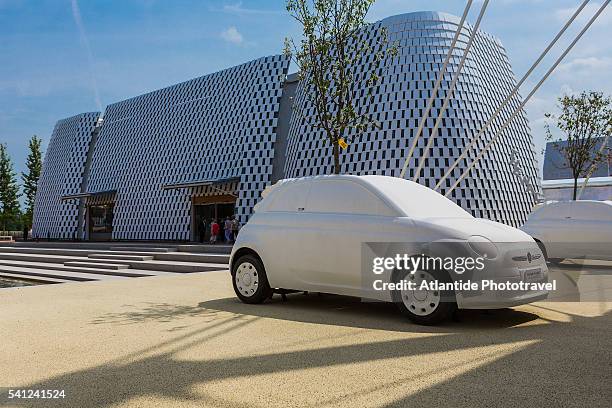 expo milano 2015 (milan universal exposition 2015), the installation of the fiberglass fiat 500 c and the intesa sanpaolo pavilion - fiat 500 c stock pictures, royalty-free photos & images
