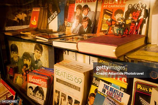 memorabilia display at the beatles shop - liverpool beatles stock pictures, royalty-free photos & images