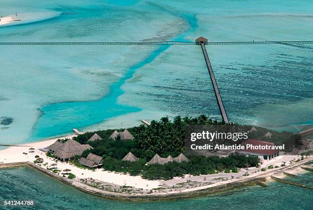 aerial view of veligandu hura and pier - male maldives ストックフォトと画像