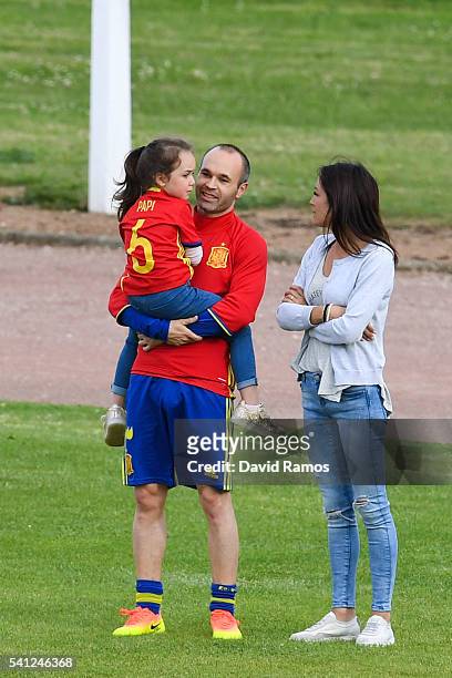 Andres Iniesta of Spain shares a moment with his wife Anna Ortiz and his daughter Valeria after a training session at Complexe Sportif Marcel...