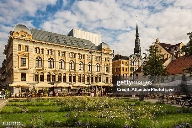 houses in livu square and, in the background, the bell-tower of st. peter church - livu square stock pictures, royalty-free photos & images