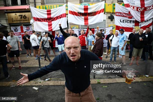 An England fan gestures as he drinks with other fans ahead of tomorrow's England v Slovakia Euro 2016 Group B match, on June 19, 2016 in...