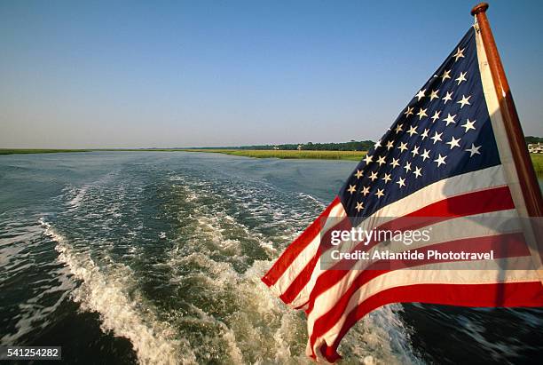 american flag on lady patricia boat - american flag ocean stock pictures, royalty-free photos & images