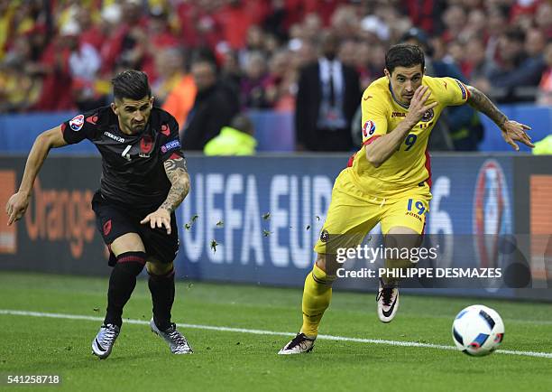 Albania's defender Elseid Hysaj vies with Romania's forward Bogdan Stancu during the Euro 2016 group A football match between Romania and Albania at...