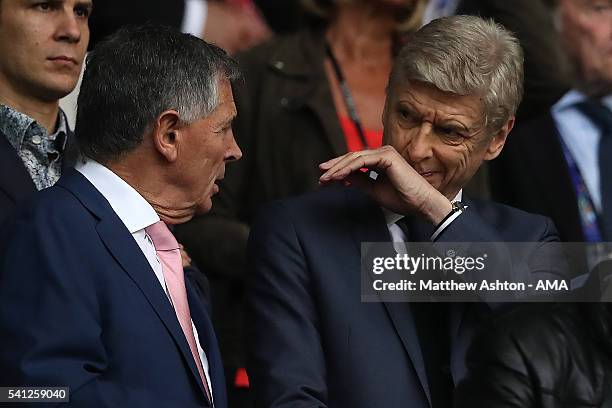 Arsenal Manager Arsene Wenger chats with former Arsenal Vice-Chairman David Dein during the UEFA EURO 2016 Group A match between Switzerland and...