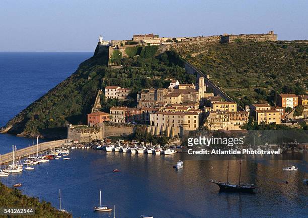 coastal village and fortress above - orbetello stock pictures, royalty-free photos & images