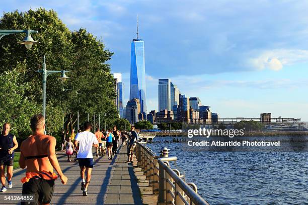 downtown view with the freedom tower from the hudson river greenway - hudson river stock pictures, royalty-free photos & images