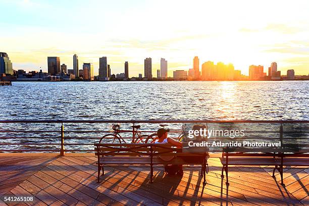 downtown view with the freedom tower from the hudson river greenway - hudson river stock pictures, royalty-free photos & images