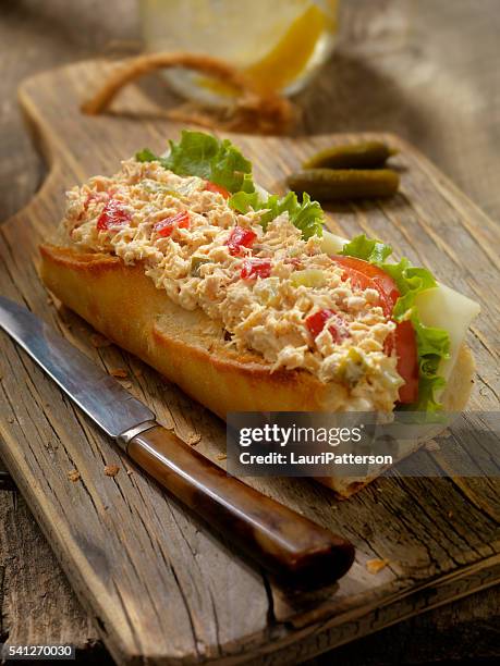 tuna salad sandwich on a baguette - tonijnsalade stockfoto's en -beelden