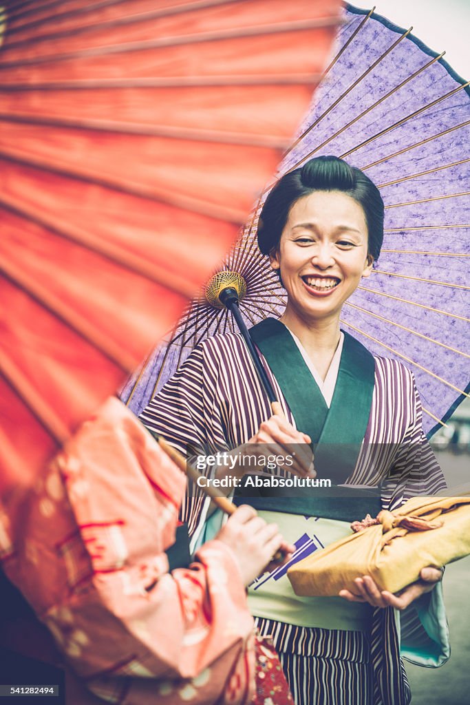 Two Beautiful Japanese Women in Kimono Holding Parasol Laughing, Kyoto