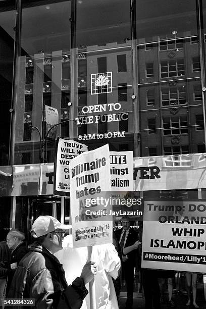 protesters at trump tower building, fifth avenue, midtown manhattan, nyc - street style new york city march 2016 stock pictures, royalty-free photos & images