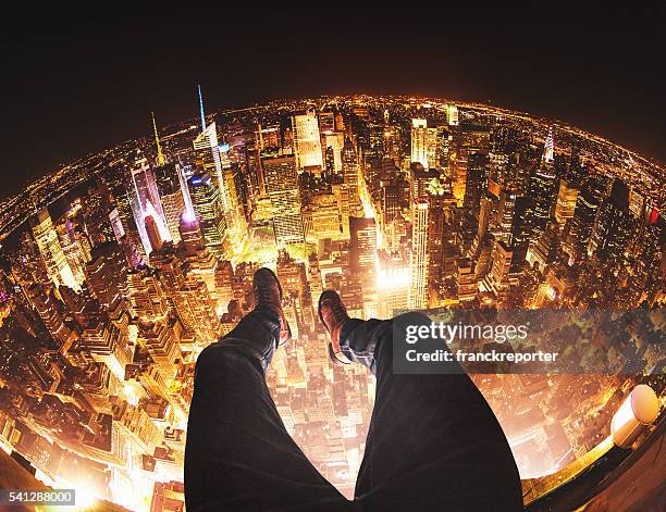 relaxing in new york city on top of a building - shoes top view stockfoto's en -beelden