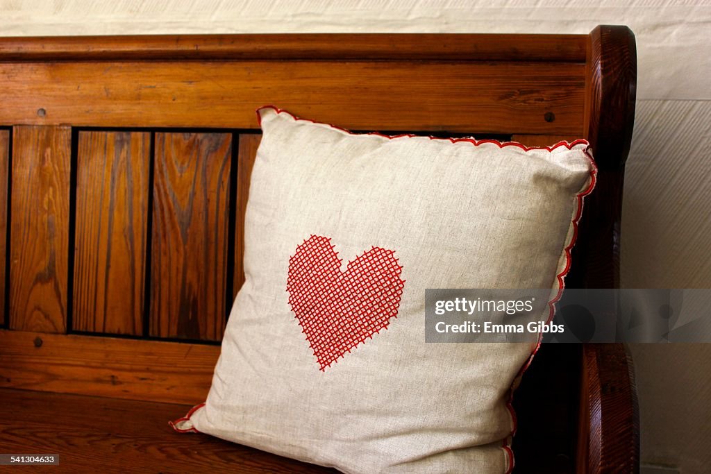 Natural coloured cushion with red nordic heart