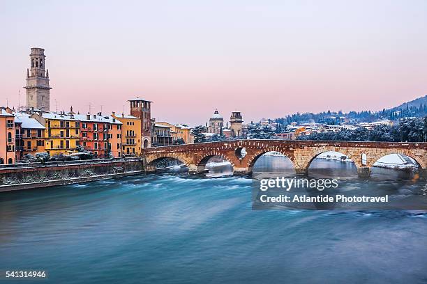the river adige and the ponte (bridge) di pietra, on the left the bell tower of the cattedrale (cathedral, duomo) di santa maria matricolare, on the background the chiesa (church) di san giorgio in braida - verona italy stock pictures, royalty-free photos & images