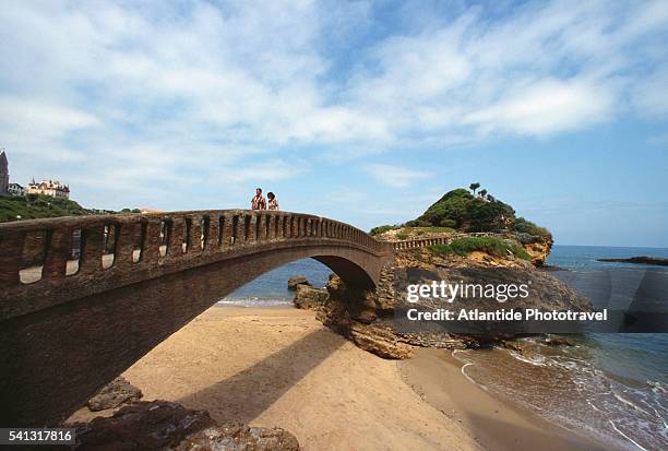 footbridge to rocher du basta - biarritz stock pictures, royalty-free photos & images