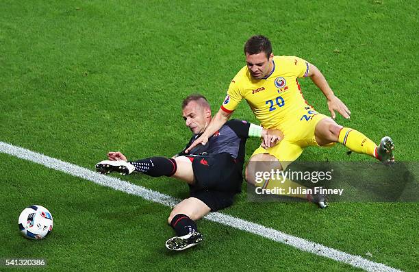 Frederic Veseli of Albania and Adrian Popa of Romania compete for the ball during the UEFA EURO 2016 Group A match between Romania and Albania at...