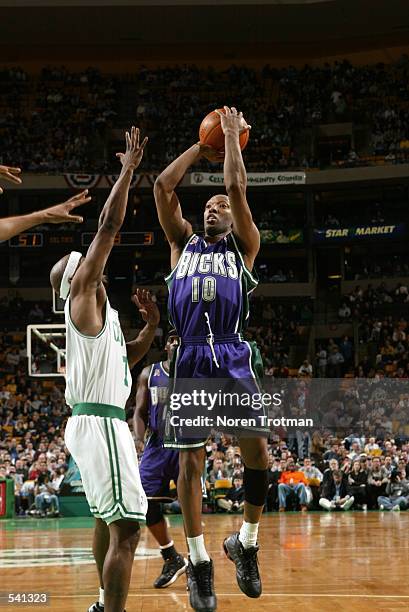 Point guard Sam Cassell of the Milwaukee Bucks shoots over point guard Kenny Anderson of the Boston Celtics during the NBA game at the FleetCenter in...